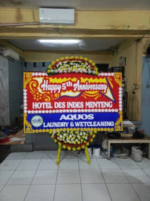 Papan Bunga di Bandara Badung