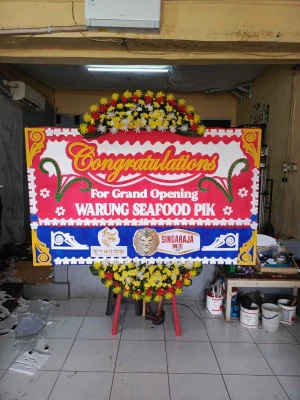Papan Bunga di Bandara Badung